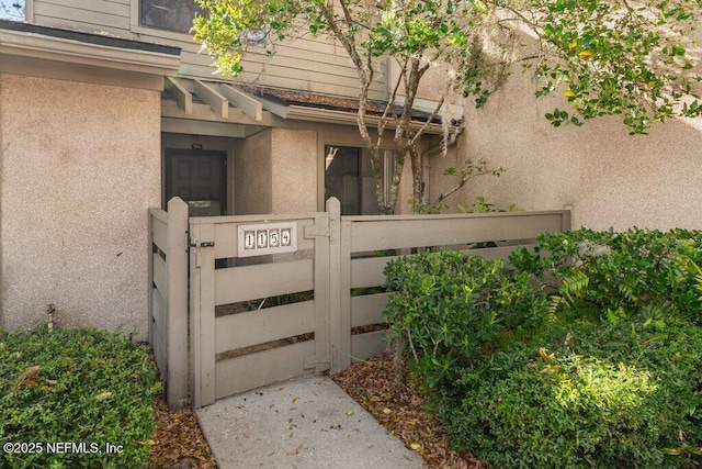 view of gate featuring fence