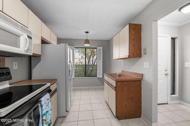 kitchen featuring white microwave, range with electric cooktop, a textured ceiling, and light tile patterned flooring