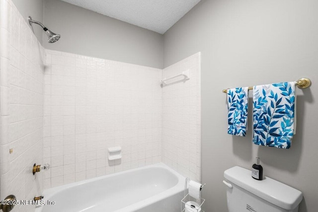 full bath featuring a textured ceiling, shower / bath combination, and toilet