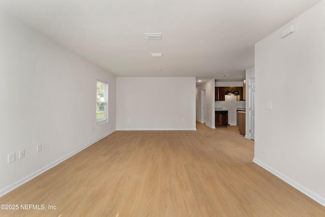 unfurnished room featuring light hardwood / wood-style flooring