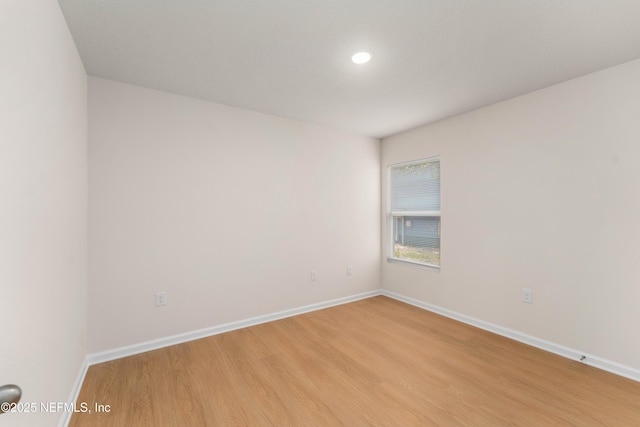 spare room with light hardwood / wood-style floors