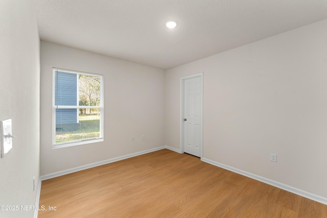 unfurnished room featuring light hardwood / wood-style flooring