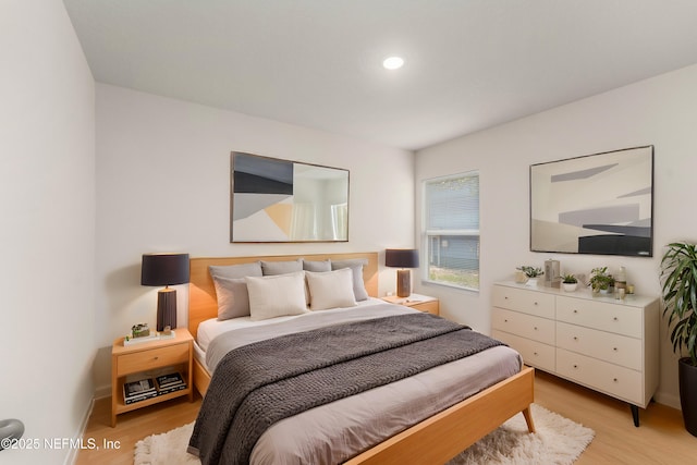 bedroom with light wood-type flooring