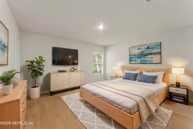 bedroom with light hardwood / wood-style flooring