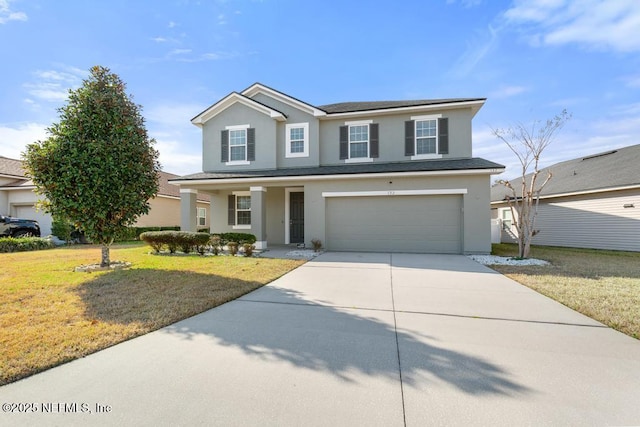 view of front property featuring a garage, a front yard, and a porch