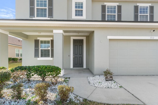 property entrance with a garage