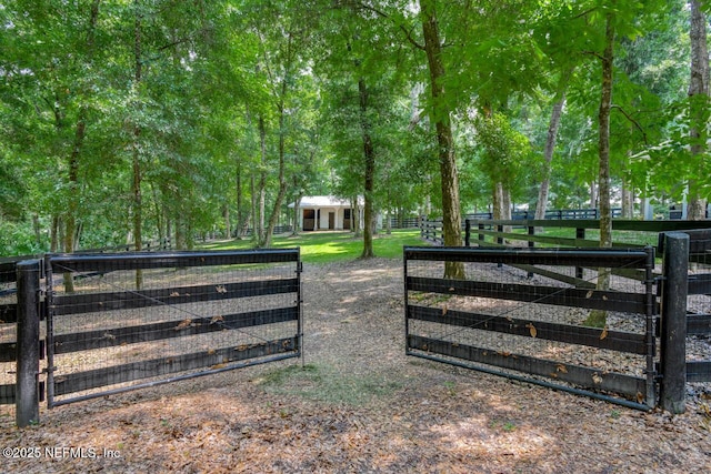 view of gate with an outdoor structure