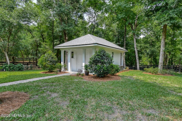 view of outdoor structure featuring a yard