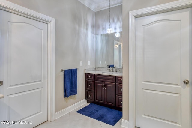 bathroom featuring tile patterned flooring, vanity, and crown molding