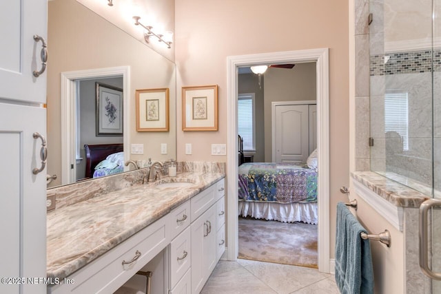 bathroom featuring vanity, an enclosed shower, and tile patterned flooring