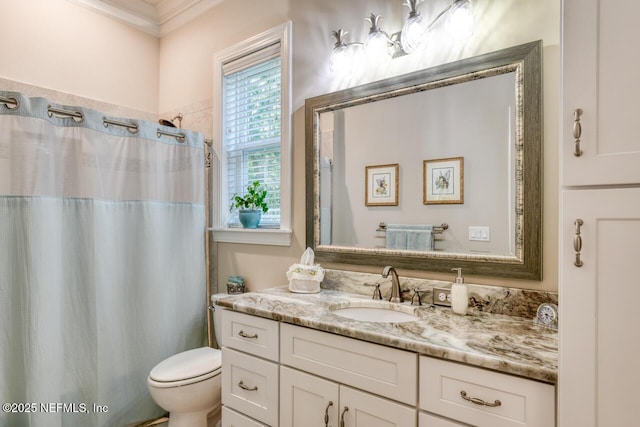 bathroom featuring a shower with curtain, vanity, and toilet