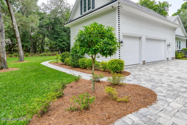 view of side of home featuring a lawn