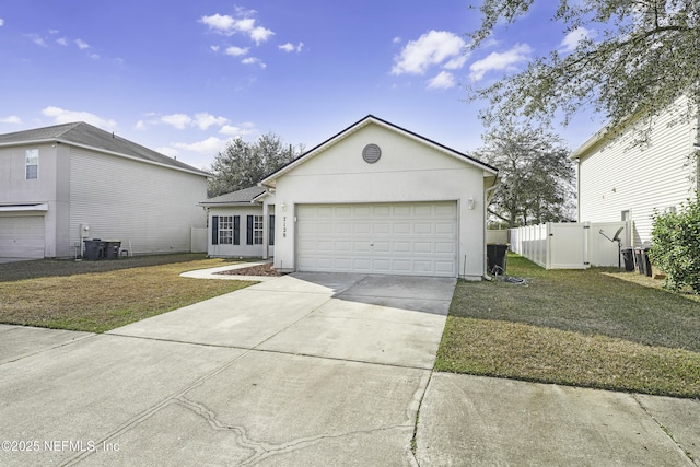 single story home featuring a garage and a front lawn