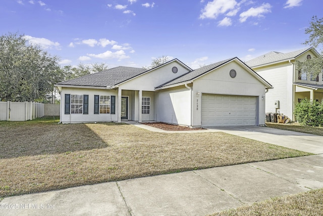 single story home with a garage and a front lawn