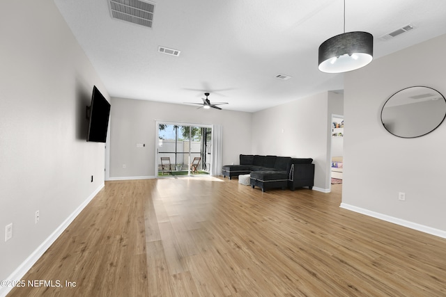 unfurnished living room with light hardwood / wood-style flooring and ceiling fan