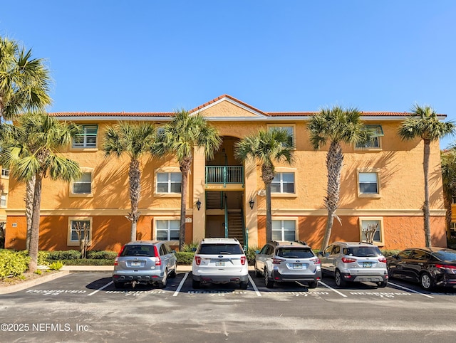 view of property with uncovered parking