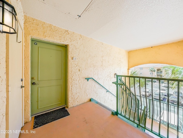 doorway to property featuring a balcony