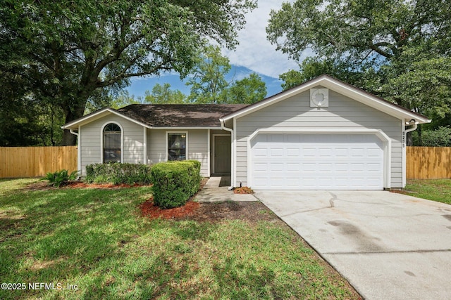 ranch-style house featuring a garage and a front lawn