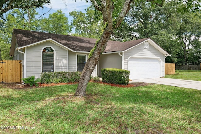 single story home with a garage and a front lawn