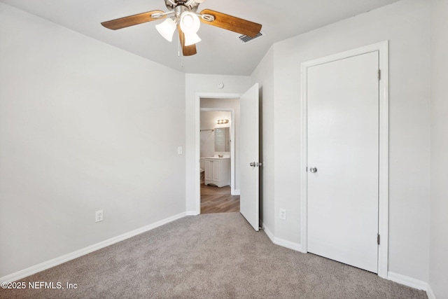 unfurnished bedroom with light colored carpet and ceiling fan