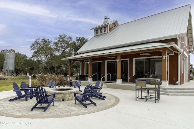 view of patio / terrace with a fire pit