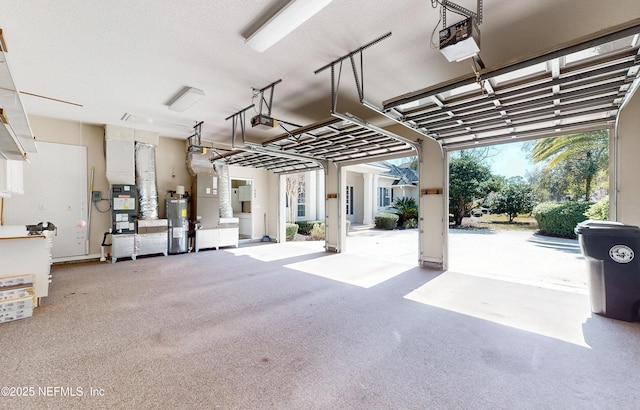 garage with a garage door opener and water heater