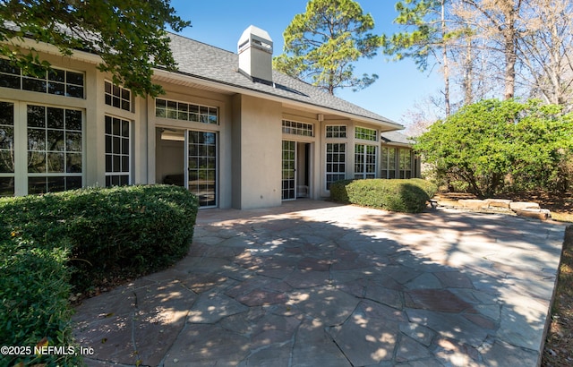 back of property featuring a patio area