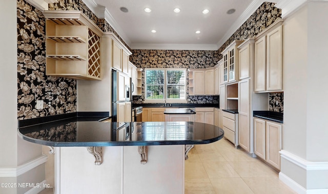 kitchen featuring crown molding, a kitchen breakfast bar, kitchen peninsula, and paneled built in refrigerator