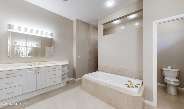 bathroom with vanity, toilet, tiled tub, tile patterned floors, and a textured ceiling