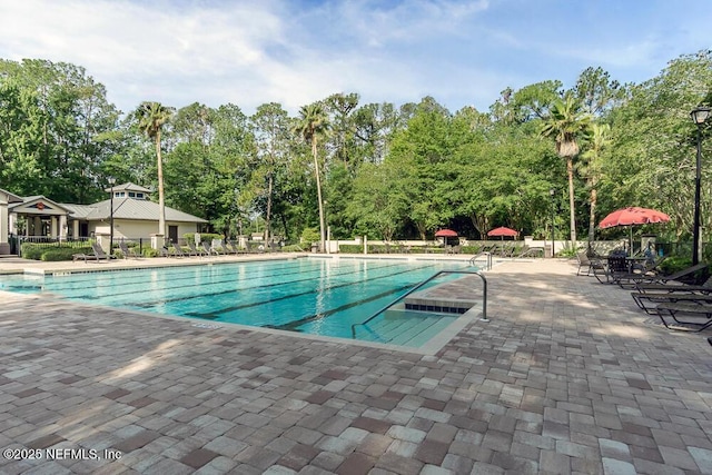 view of swimming pool featuring a patio