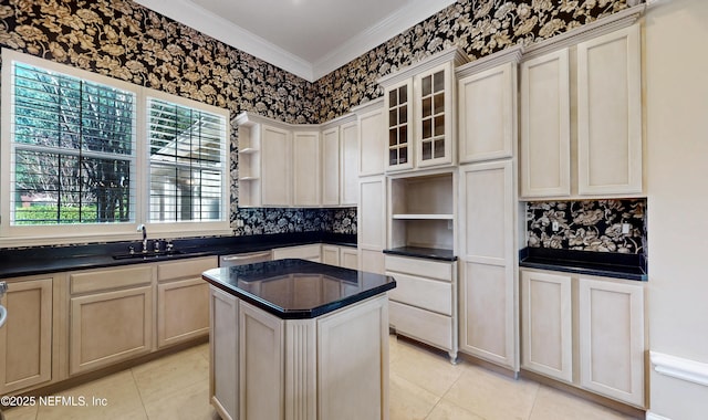 kitchen featuring a kitchen island, sink, stainless steel dishwasher, light tile patterned floors, and crown molding