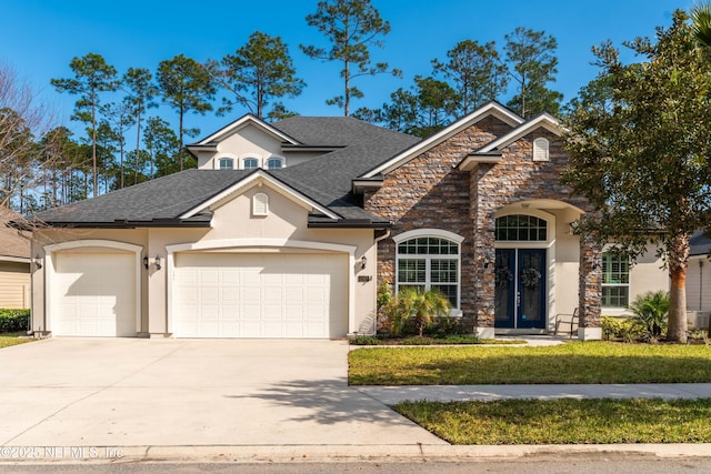 view of front of home featuring a garage and a front yard