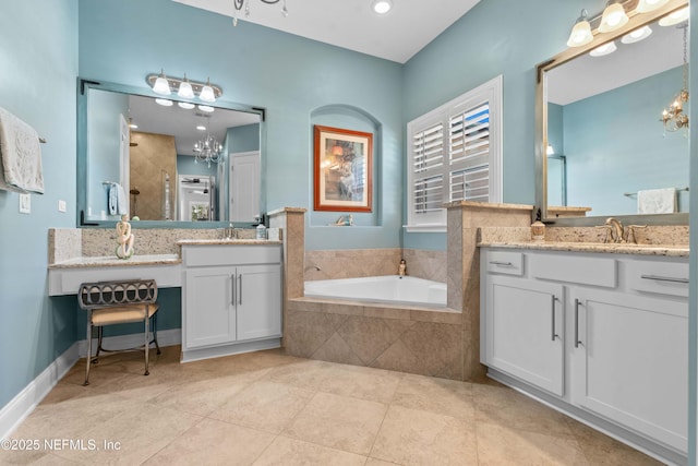 bathroom with tile patterned flooring, vanity, an inviting chandelier, and plus walk in shower