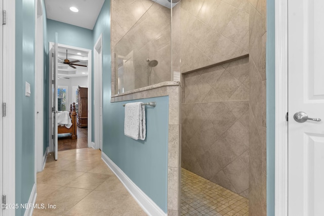 bathroom featuring tiled shower, tile patterned floors, and ceiling fan