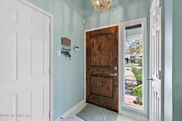 entryway with a healthy amount of sunlight and a notable chandelier