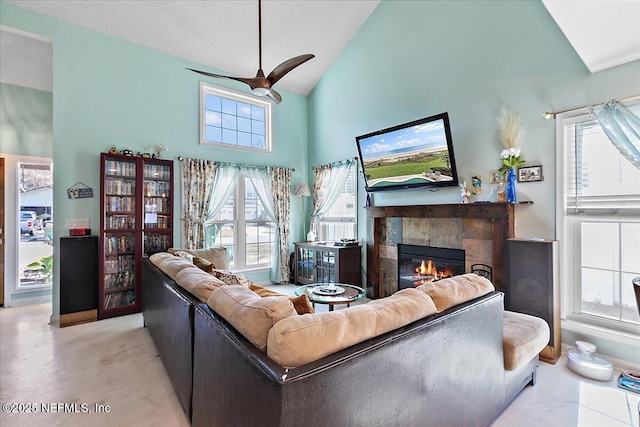 living room with high vaulted ceiling and a fireplace