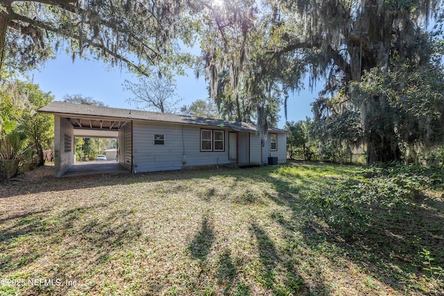 back of property featuring cooling unit, a patio, and a lawn