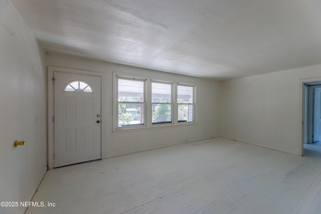 foyer entrance with light wood-type flooring