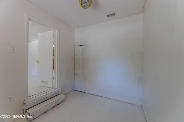 bathroom with concrete flooring