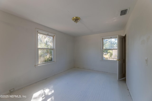 spare room featuring a wealth of natural light