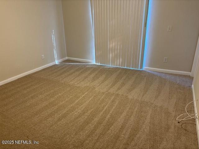 spare room with carpet flooring