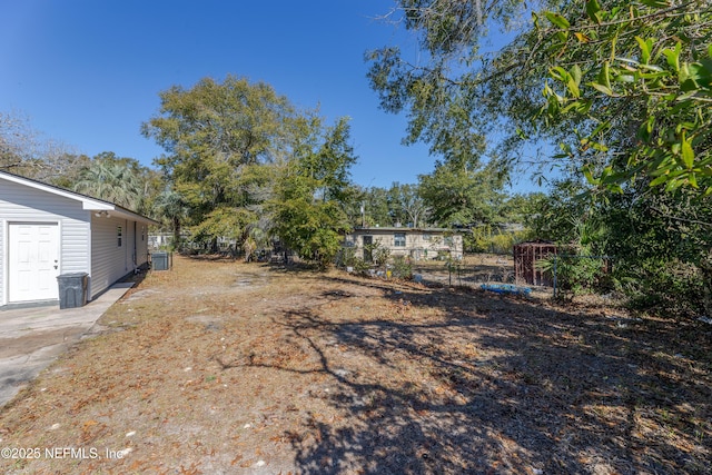 view of yard with central AC