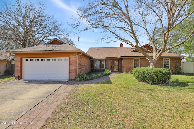 ranch-style home with a garage and a front yard