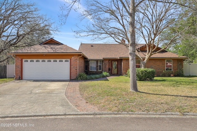 ranch-style house featuring a garage and a front lawn