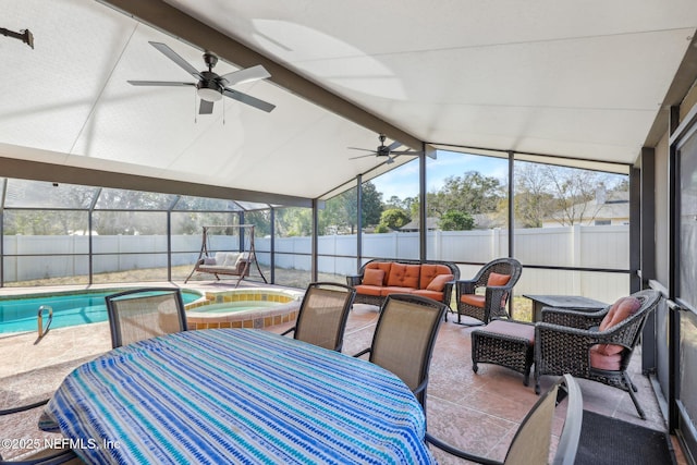 sunroom featuring vaulted ceiling with beams and ceiling fan