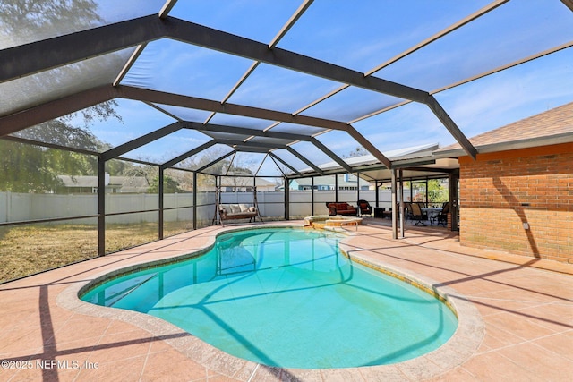 view of pool featuring a lanai and a patio