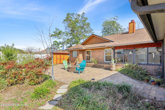 back of property featuring a patio