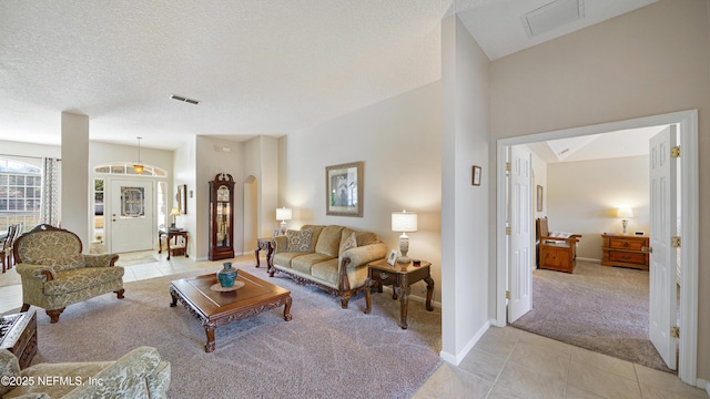 living room with light carpet and a textured ceiling