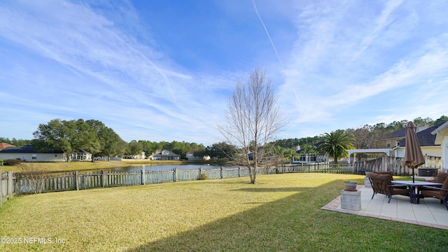 view of yard featuring a patio and a water view