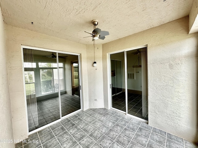 view of patio with ceiling fan